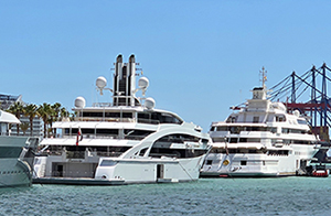 Mega yachts anchor in the port of Malaga